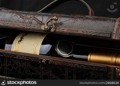 Cognac bottle in wooden case background
