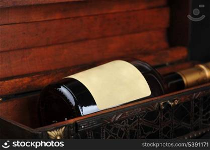 Cognac bottle in wooden case background