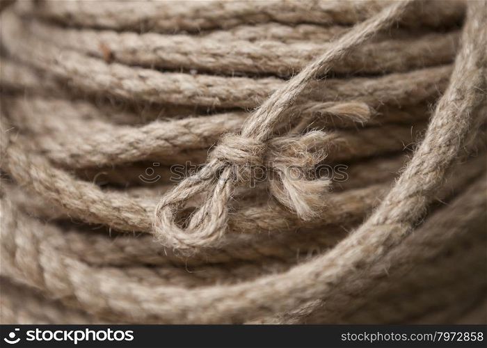 Coil of rope with marine knot loop.. Coil of rope with marine knot loop. Roll of ship ropes as background texture