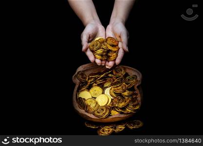 Coin gold in lady hand on lots stacking golden coins in broken jar white background, Money stack for business planning investment and saving future concept