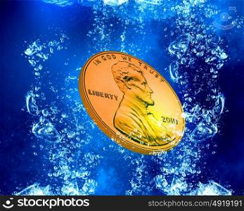 Coin under water. Money coin falling in blue water with bubbles
