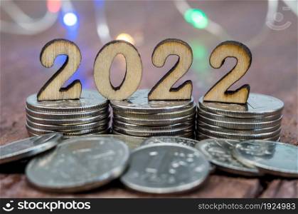 Coins and Figures 2022. Banner 2022. Money stacked in columns.. Banner 2022. Coins and Figures 2022. Money stacked in columns.