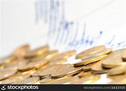 coins and financial graph on background
