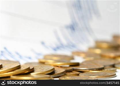 coins and financial graph on background