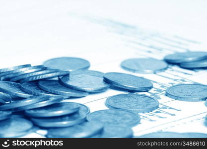 coins and financial graph on background