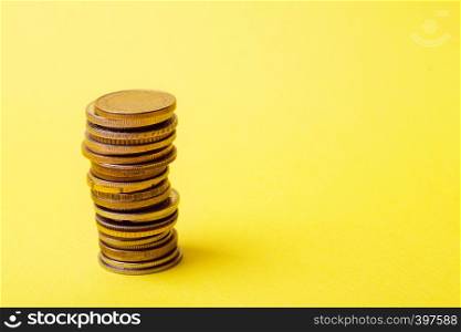 coins are lined with a column on a yellow background