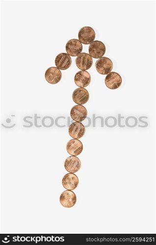 Coins arranged in an arrow shape