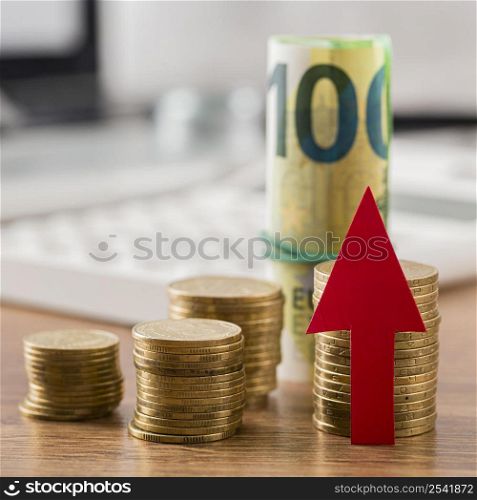 coins banknotes with growth arrow