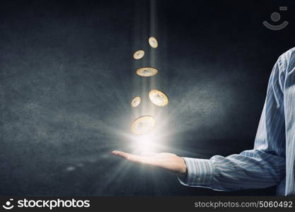 Coins in hand. Close up of businesswoman holding in palms euro coin