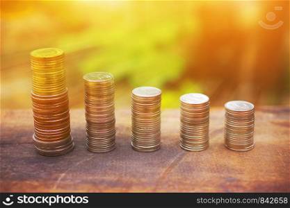 Coins stack money on wood table Business finance investment growing concept