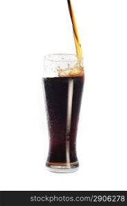 cola pour into glass on white background