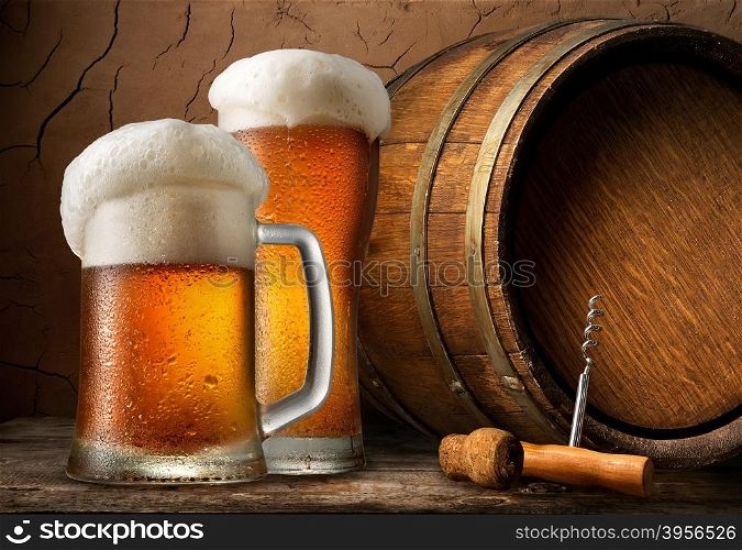 Cold beer and wooden barrel in cellar