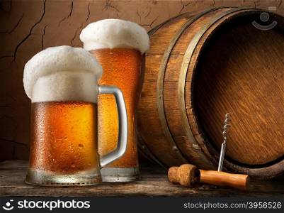 Cold beer and wooden barrel in cellar