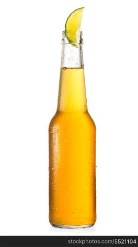 cold bottle of beer with lime on white background