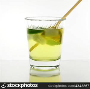 cold cocktail with lemon , close up