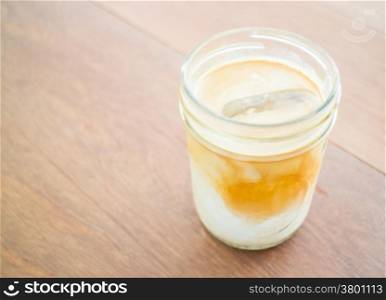 Cold coffee latte with ice in glass, stock photo