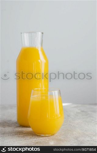 Cold fresh orange juice filled in glassware, full of vitamins, isolated over white background. Refreshing fruit drink. Isolated beverage