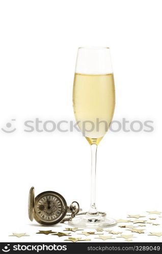 cold glass of champagne with a old pocket watch and stars. cold glass of champagne with a old pocket watch and metal stars on white background