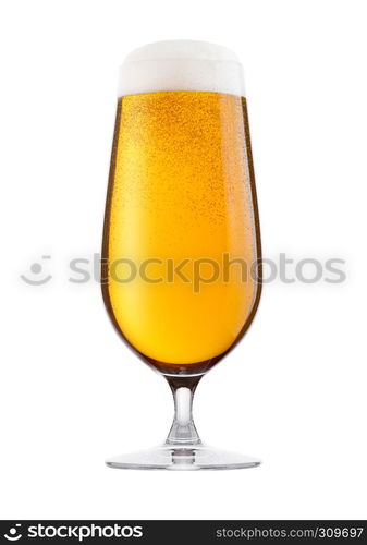 Cold glass of lager beer with foam and dew isolated on white background