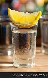 cold glass of vodka with lemon