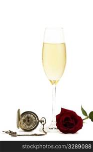 cold glass with champagne with a red rose and a old pocket watch. cold glass with champagne with a red rose and a old pocket watch on white background