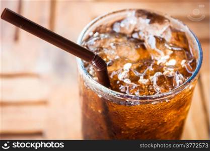 Cold glass with cola and ice cubes