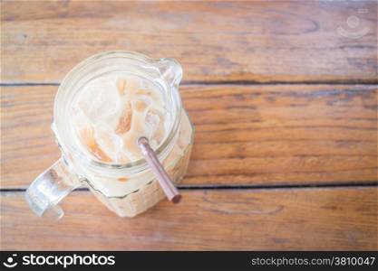Cold milk coffee in glass pitcher, stock photo