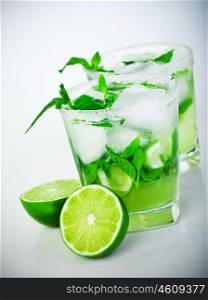 Cold mojito drink, glass of icy alcohol refreshing booze, tasty Cuban alcoholic cocktail made of fresh mint leaves and lime fruit, food and beverage still life, party and holidays celebration