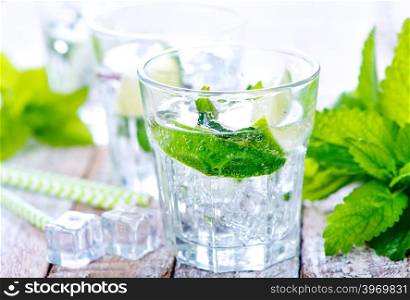 cold mojito in glass and on a table