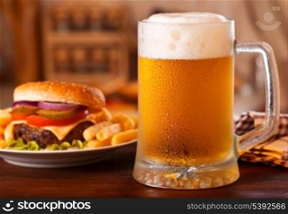 cold mug of beer and hamburger