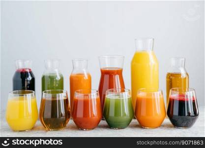 Cold organic fruit juice in glass jars against white background. Healthy drink concept. Homemade beverage containing vitamins