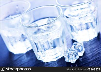 cold water with ice cubes in the glass