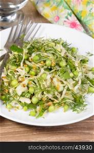 Coleslaw with cucumbers and peas, seasoned with dijon mustard and dill