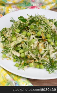 Coleslaw with cucumbers and peas, seasoned with dijon mustard and dill