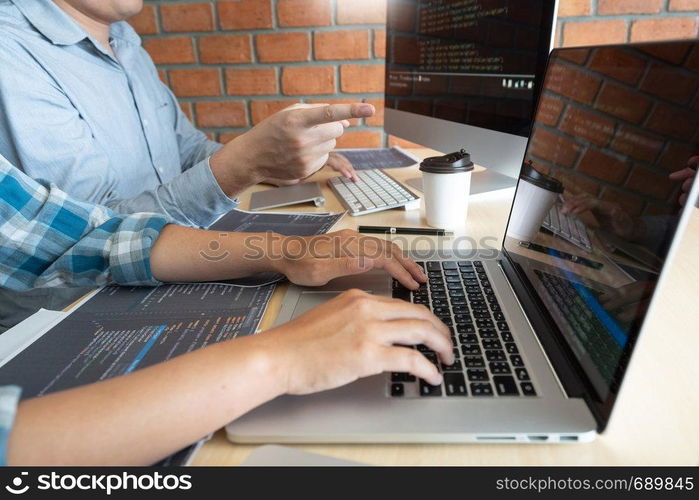 Collaborative work Software engineers website developer technologies or programmer working coding on startup ai application project on screen with partner in coworking space office company