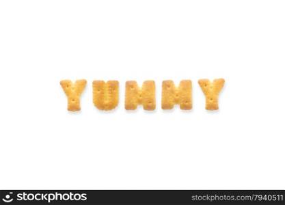 Collage of the character word YUMMY. Alphabet cookie cracker isolated on white background
