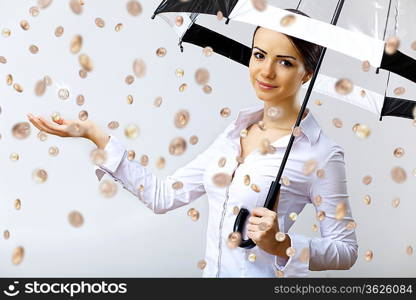 Collage with business woman under money rain with umbrella