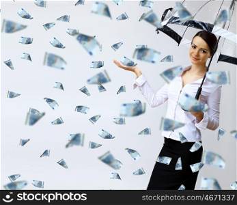 Collage with business woman under money rain with umbrella