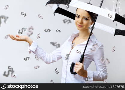 Collage with business woman under money rain with umbrella