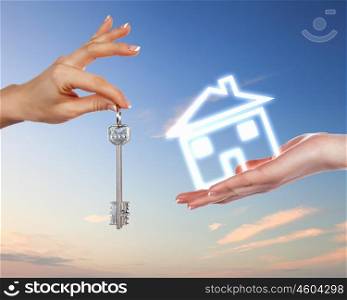 Collage with human hands and house against blue sky