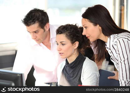 colleagues behind a computer