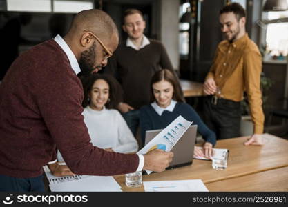 colleagues having meeting office