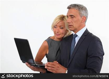 Colleagues looking at computer screen