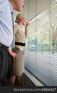 Colleagues looking out of window