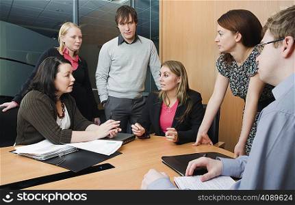 Colleagues meeting in boardroom