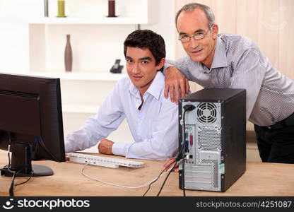 Colleagues working on a PC