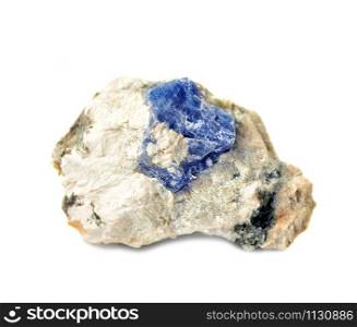 Collectible specimen of blue corundum Sapphire crystal in matrix from Ural, isolated on white background