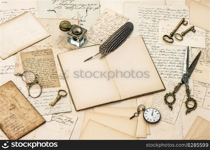 collectibles, antique accessories, old letters, inkwell and vintage feather ink pen. nostalgic sentimental paper background
