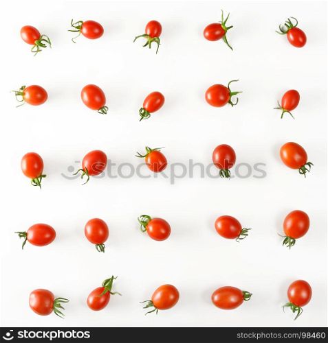 Collection cherry tomatoes on white background. Top view. The vegetable pattern flat lay.