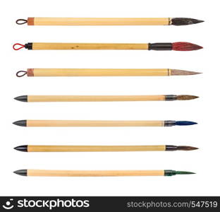 collection from various bamboo paintbrushes with colored round tips for sumi-e ( suibokuga) painting and calligraphy isolated on white background